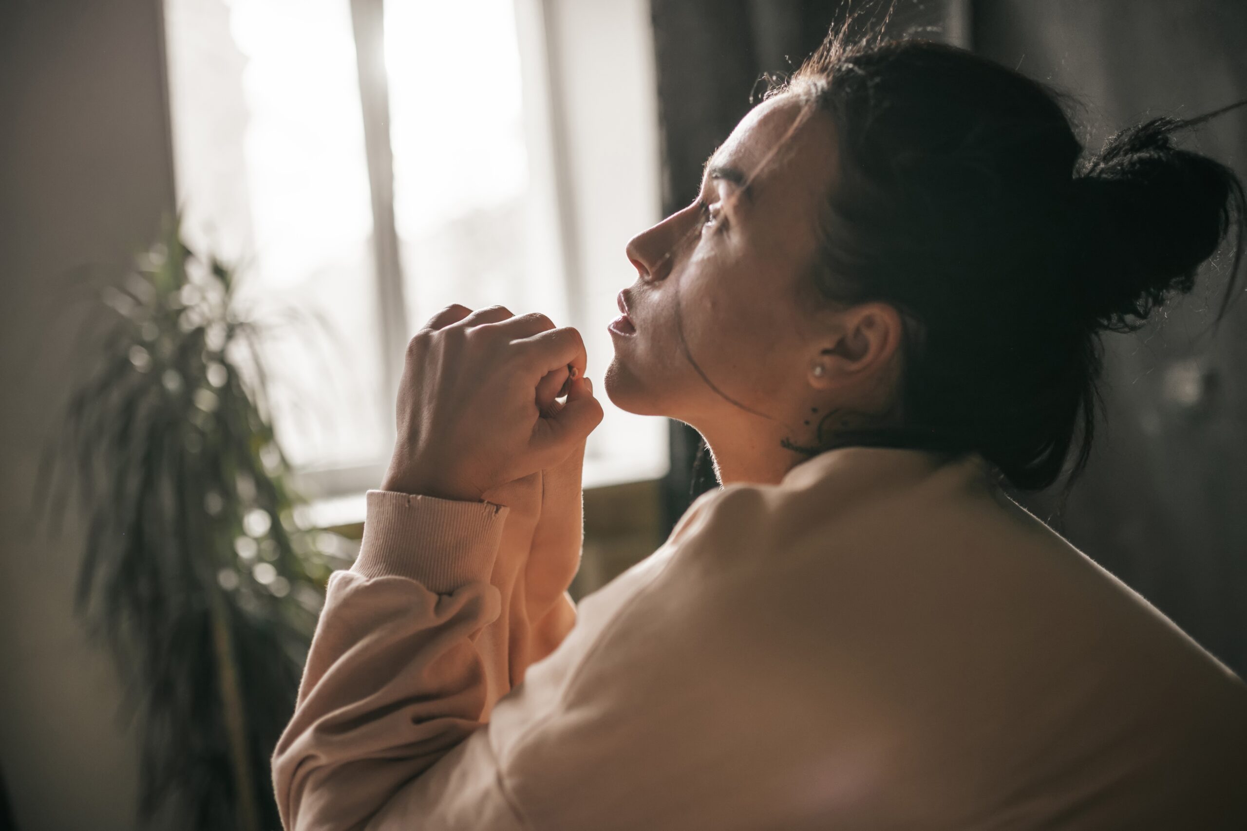 7 Bible Verses about Generosity-sad girl by a window