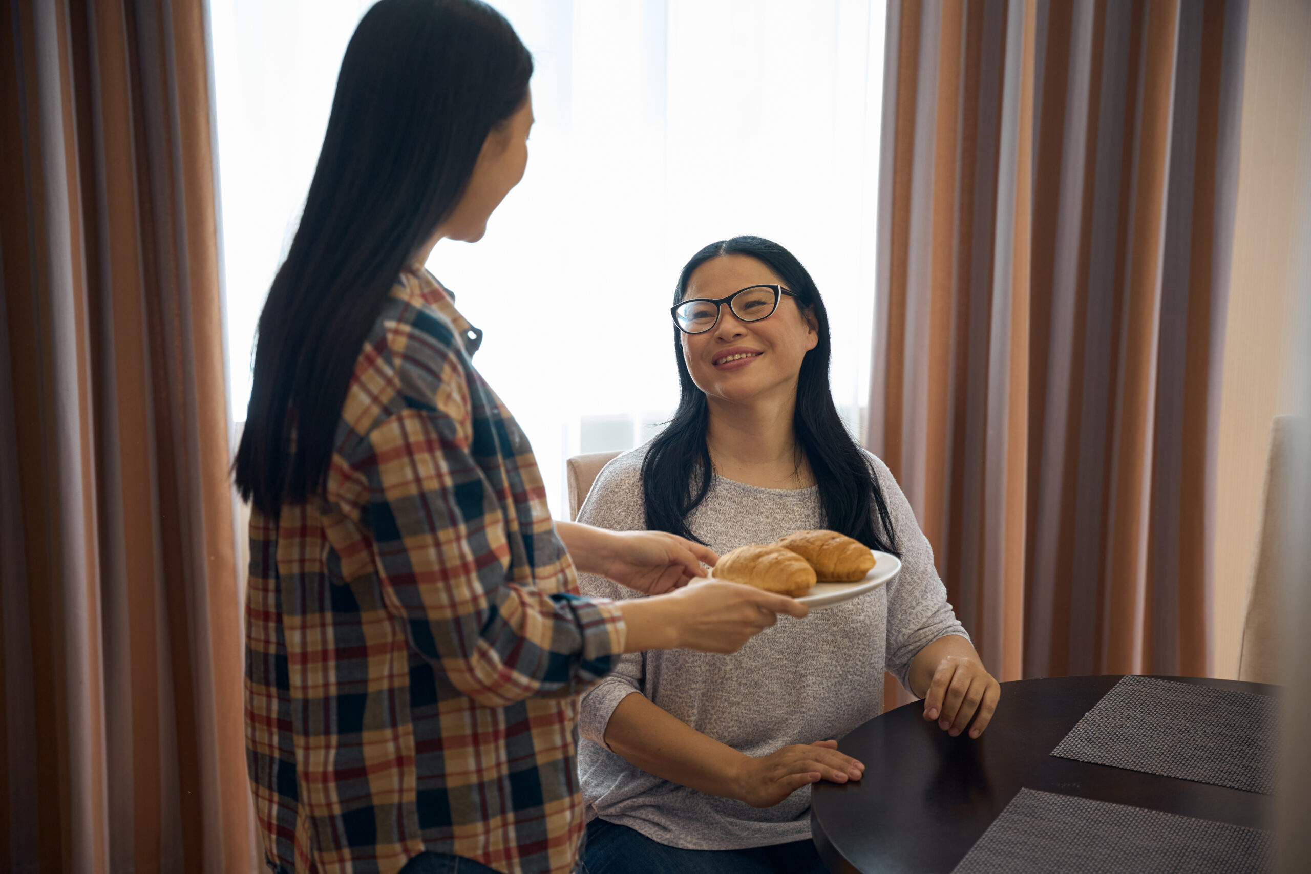 7 Bible Verses about Generosity-a daughter serves her mother brunch