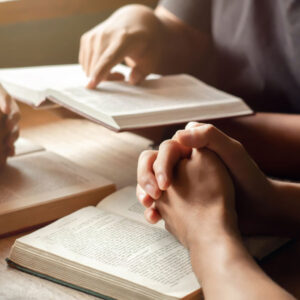 People Praying Together Reading The Bible