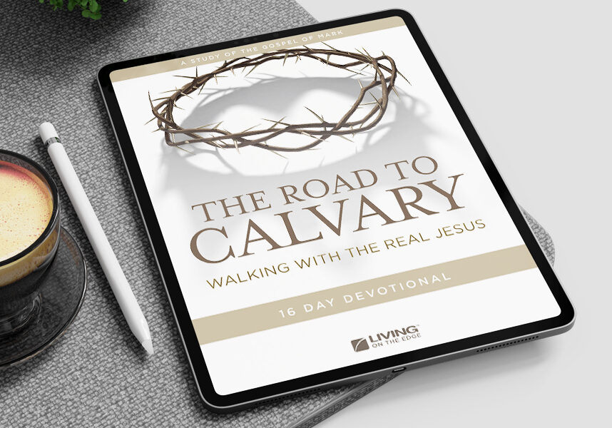 A tablet displaying a digital devotional cover titled "The Road to Calvary: Walking with the Real Jesus," featuring an illustration of a crown of thorns.